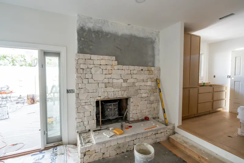 Living room fireplace getting its new stone